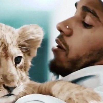 Lewis Hamilton with lion cub