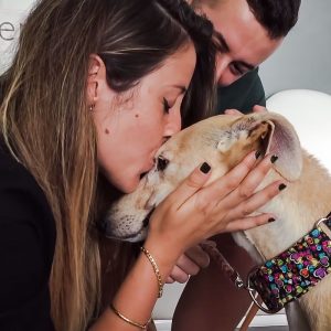 Loving kiss for scared but rehabilitated dog