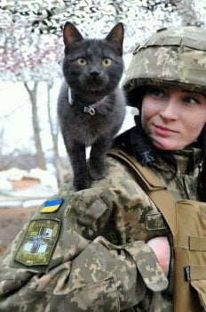 Ukrainian soldier and cat companion